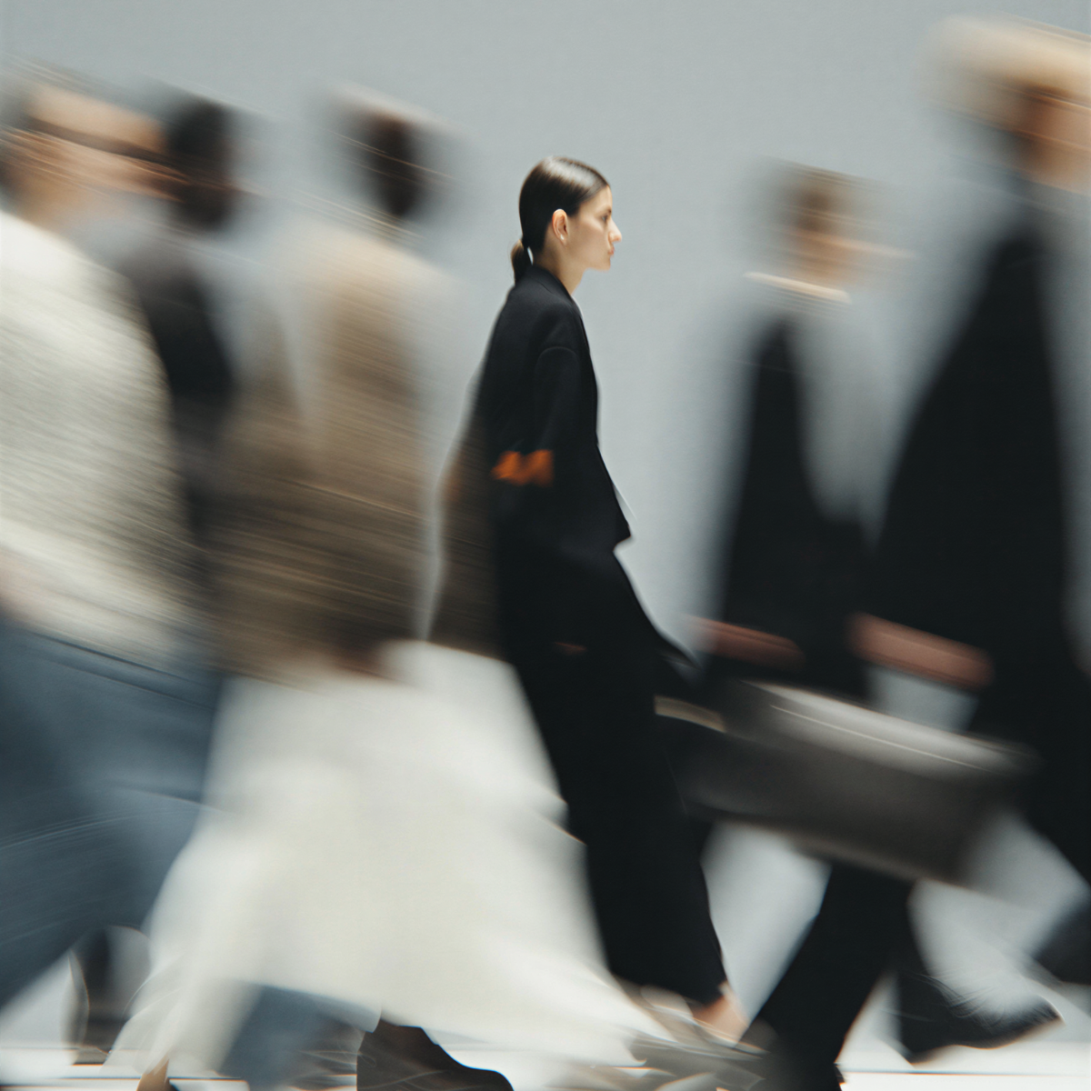 Blurred crowd of fashion models in motion